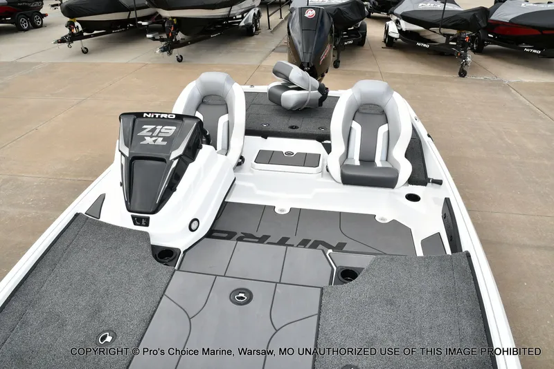 Slide: The Image of 2026 Nitro Z19 XL Pro boat on a parking lot. - 13