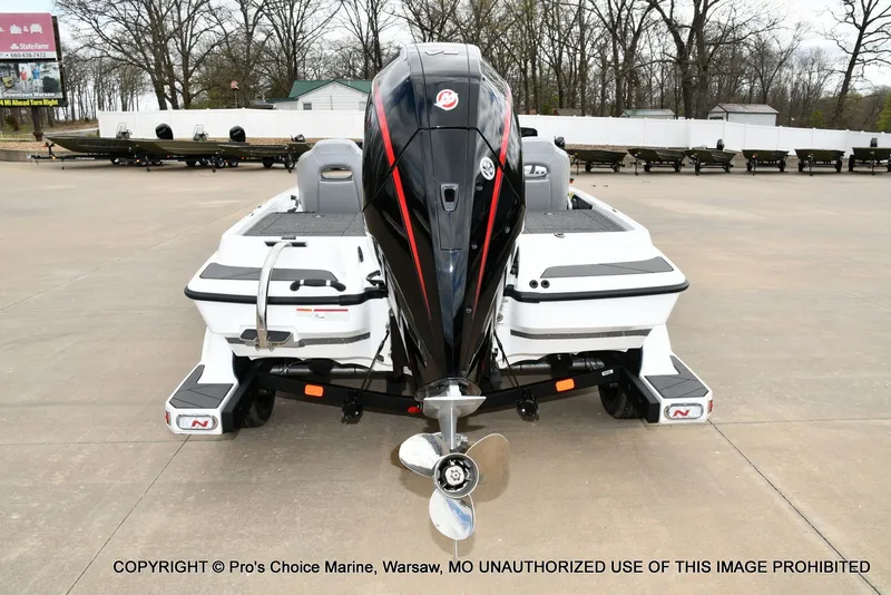 Slide: The Image of Rear view of Nitro Z19 XL Pro boat, 2026 model, on a parking lot. - 31