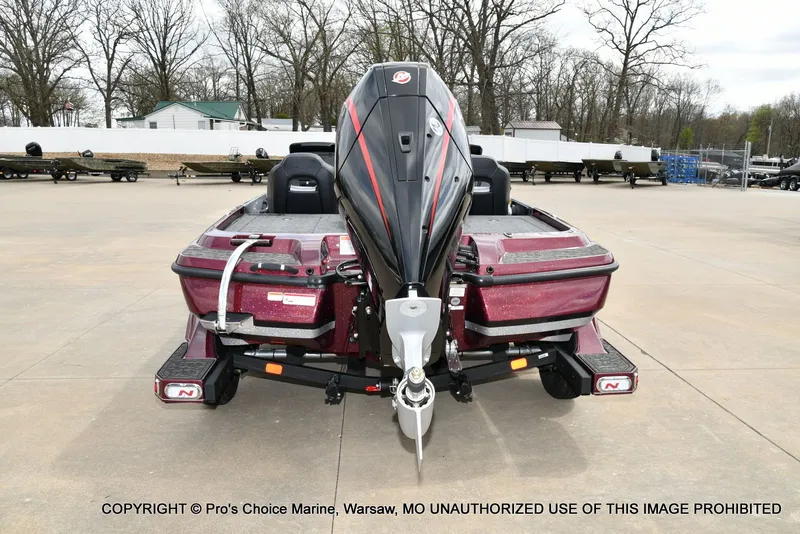 Slide: The Image of Rear view of Nitro Z21 XL boat, 2026 model, in a parking lot. - 24
