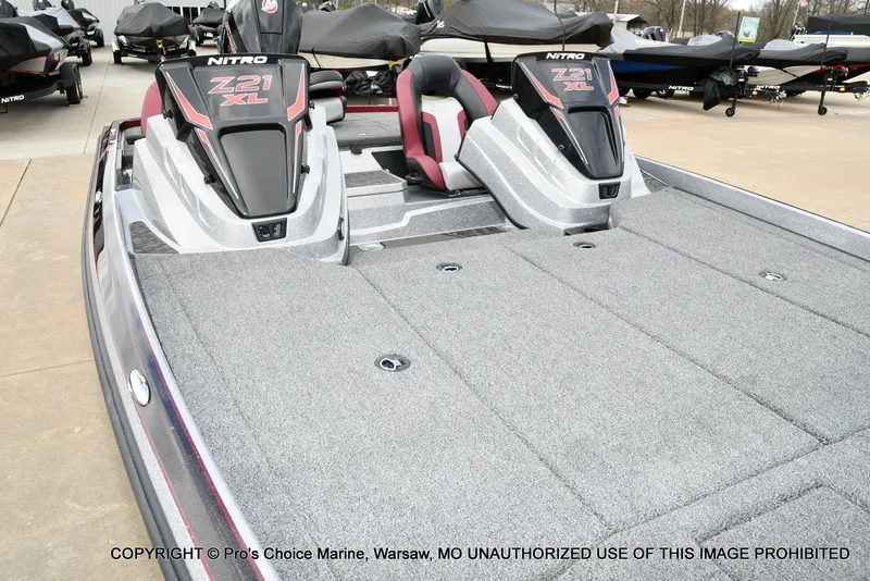 Slide: The Image of 2026 Nitro Z21 XL boat with gray deck and red accents. - 32
