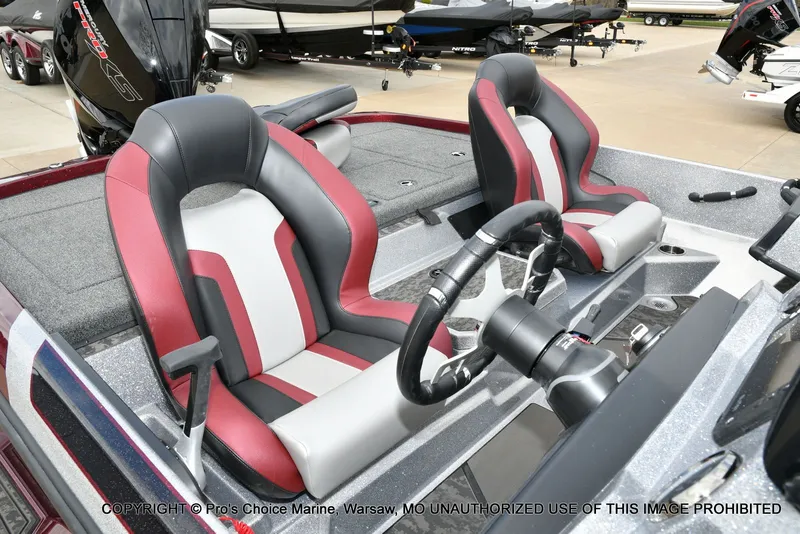 Slide: The Image of Interior of 2026 Nitro Z21 XL with red and gray seats. - 33