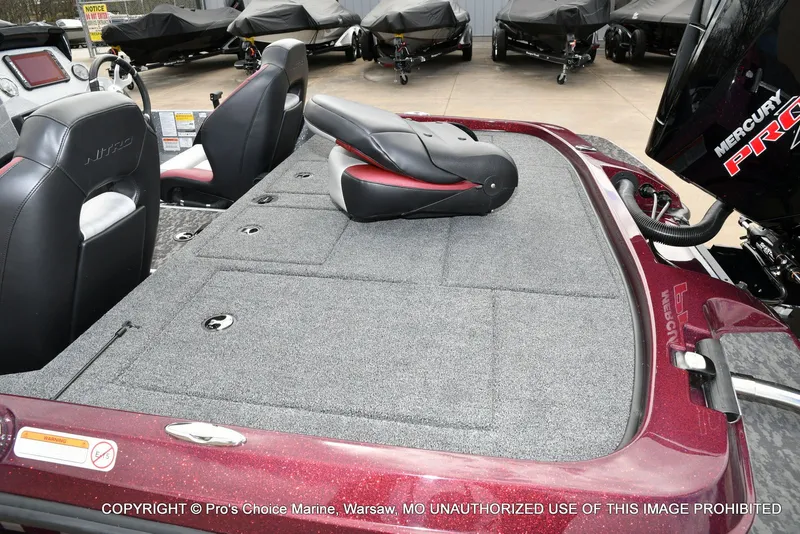 Slide: The Image of Interior of Nitro Z21 XL boat, 2026 model, featuring gray carpet flooring. - 37