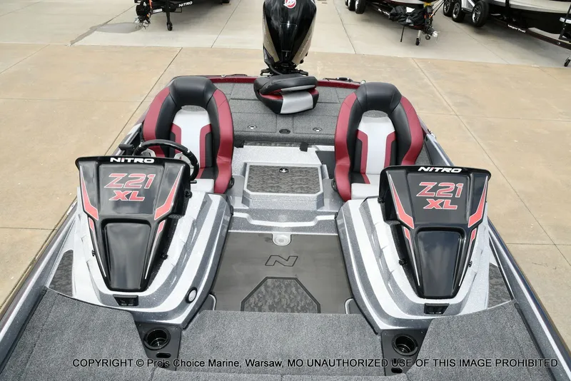 Slide: The Image of 2026 Nitro Z21 XL boat with red seats and motor. - 49