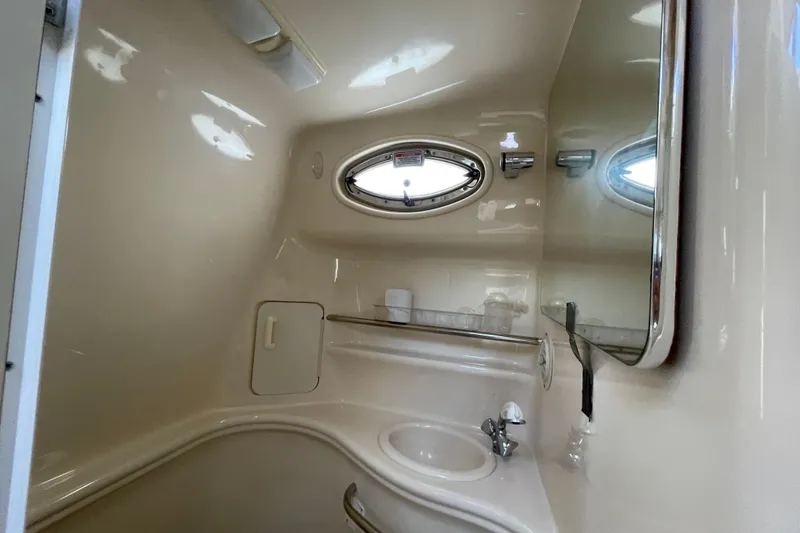 Slide: The Image of Bathroom interior of 2002 Sea Ray 340 Sundancer yacht with sink and mirror. - 30