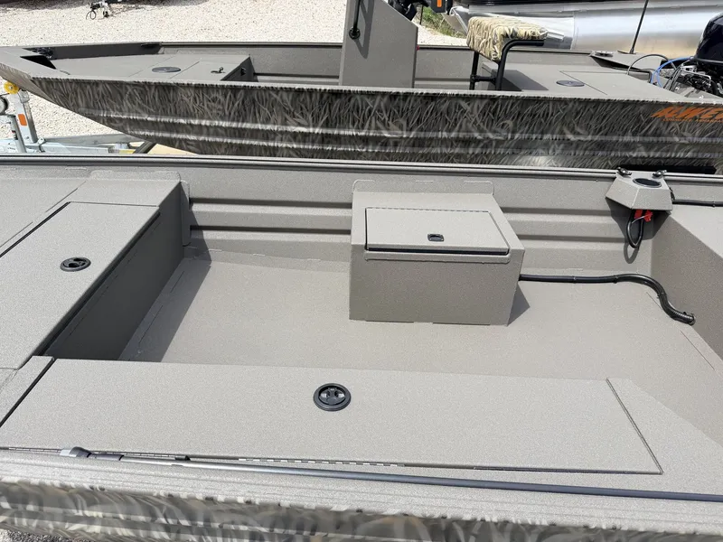 Slide: The Image of 2026 Alweld 1648 Marsh Tiller-40 boat interior, gray surface. - 7