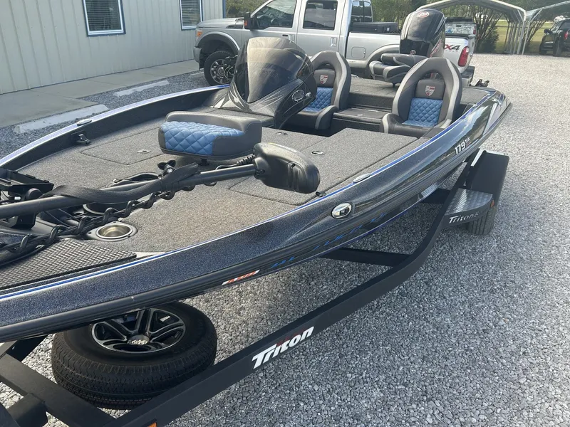 Slide: The Image of 2020 Triton 179 TrX boat on trailer, gray and blue upholstery. - 3
