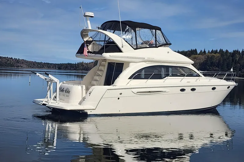 The Image of 2003 Meridian 411 Sedan yacht on calm water with scenic forest backdrop. - 0