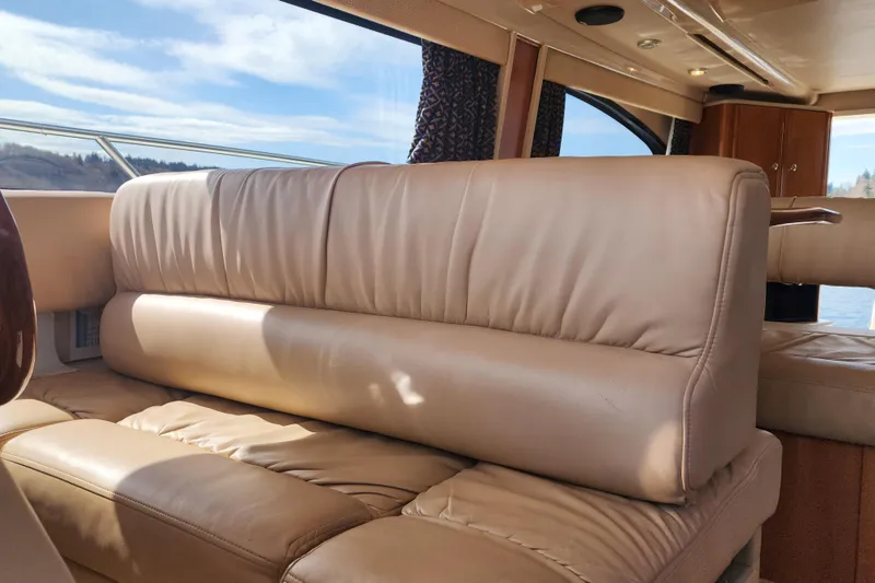 Slide: The Image of Luxurious interior of a 2003 Meridian 411 Sedan yacht with beige leather seating. - 17