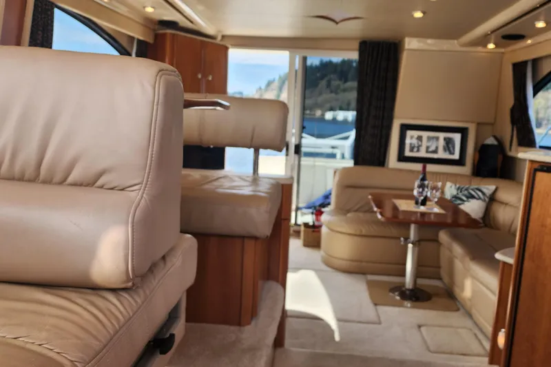 Slide: The Image of Luxurious interior of a 2003 Meridian 411 Sedan yacht with leather seating and elegant decor. - 19