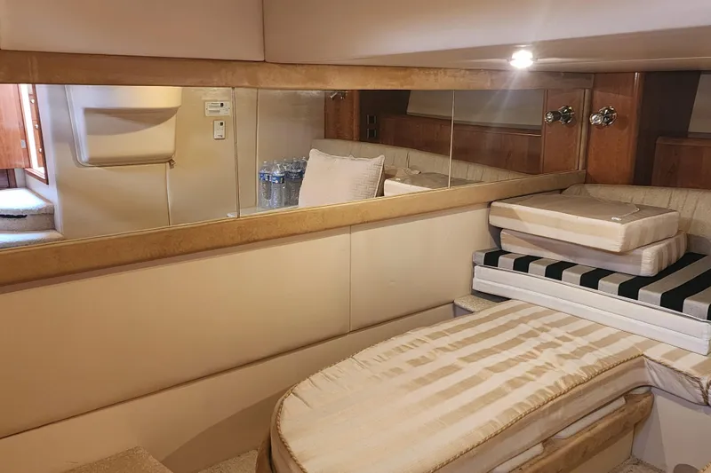 Slide: The Image of Interior cabin of a 2003 Meridian 411 Sedan yacht with beige upholstery. - 25
