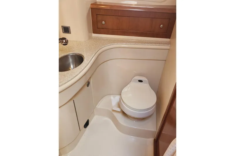 Slide: The Image of Bathroom interior of 2003 Meridian 411 Sedan yacht with sink and toilet. - 26