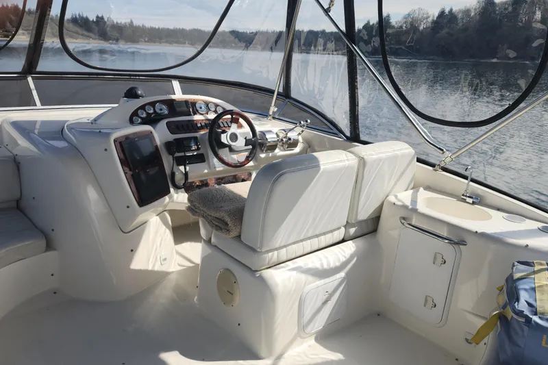Slide: The Image of Interior of a 2003 Meridian 411 Sedan yacht with steering console and seating. - 37