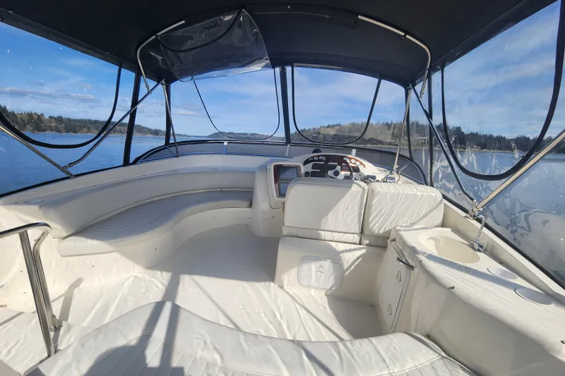 Slide: The Image of 2003 Meridian 411 Sedan boat interior with panoramic water views and luxurious seating. - 39