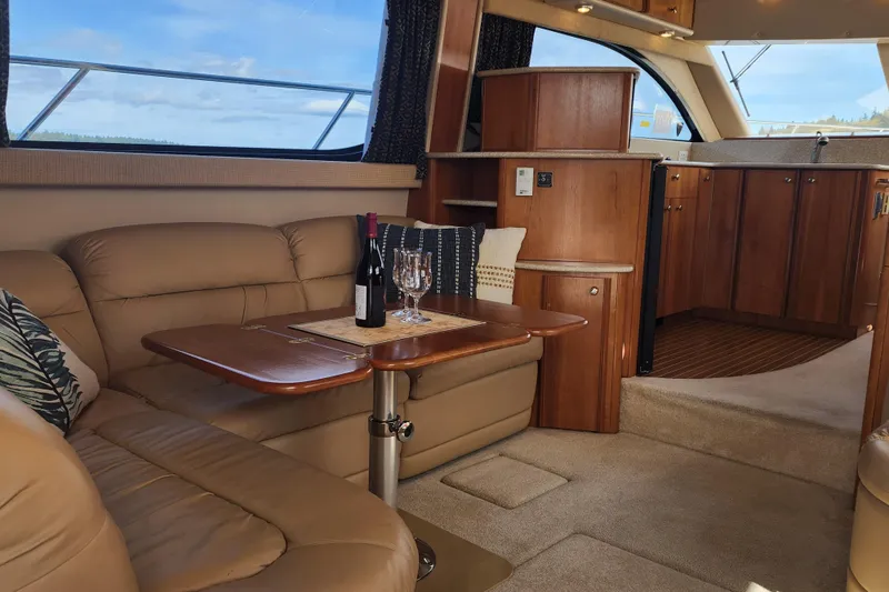 Slide: The Image of Luxurious interior of a 2003 Meridian 411 Sedan yacht with leather seating and wooden cabinetry. - 4