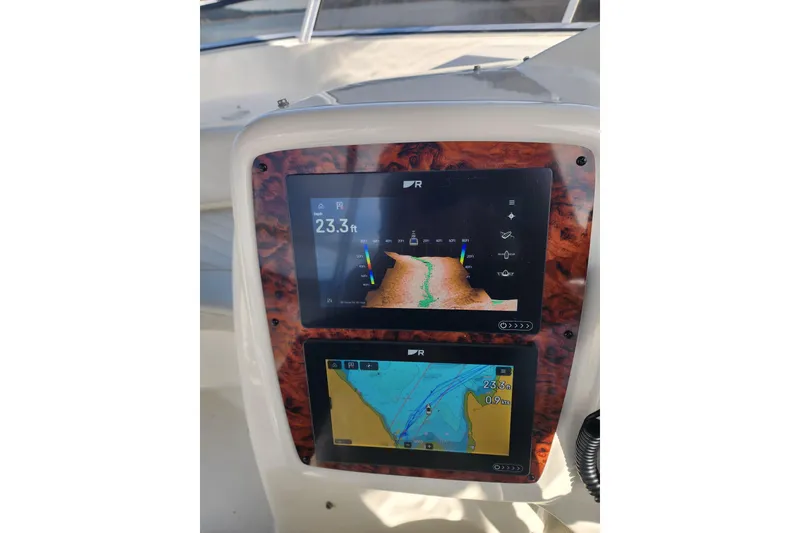 Slide: The Image of Navigation display on a 2003 Meridian 411 Sedan boat, showing depth and map data. - 50