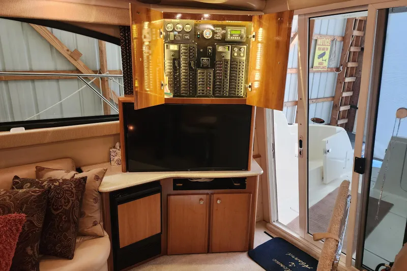 Slide: The Image of Interior of 2003 Meridian 411 Sedan with control panel and TV setup. - 54