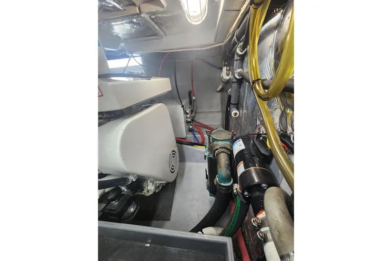Slide: The Image of Engine room of a 2003 Meridian 411 Sedan, showcasing mechanical components and wiring. - 55