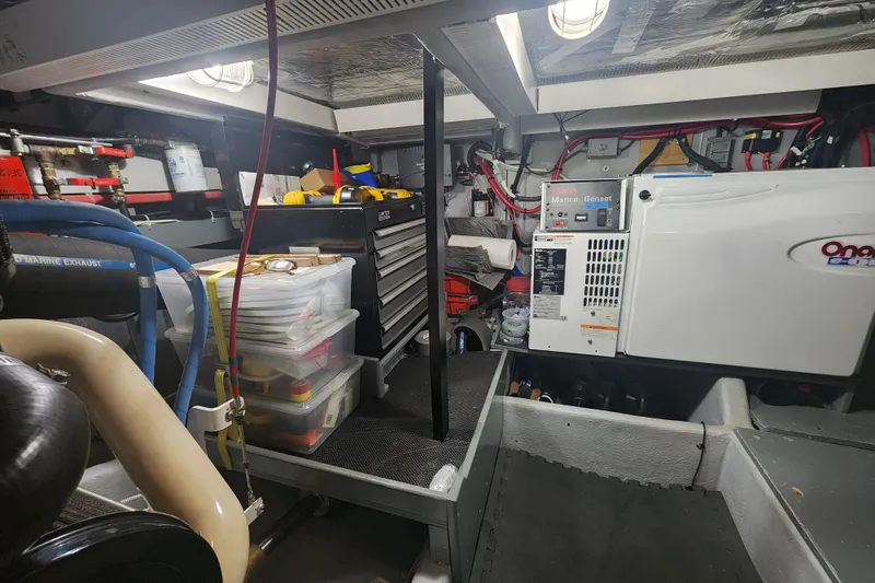 Slide: The Image of Engine room of a 2003 Meridian 411 Sedan with organized tools and equipment. - 59