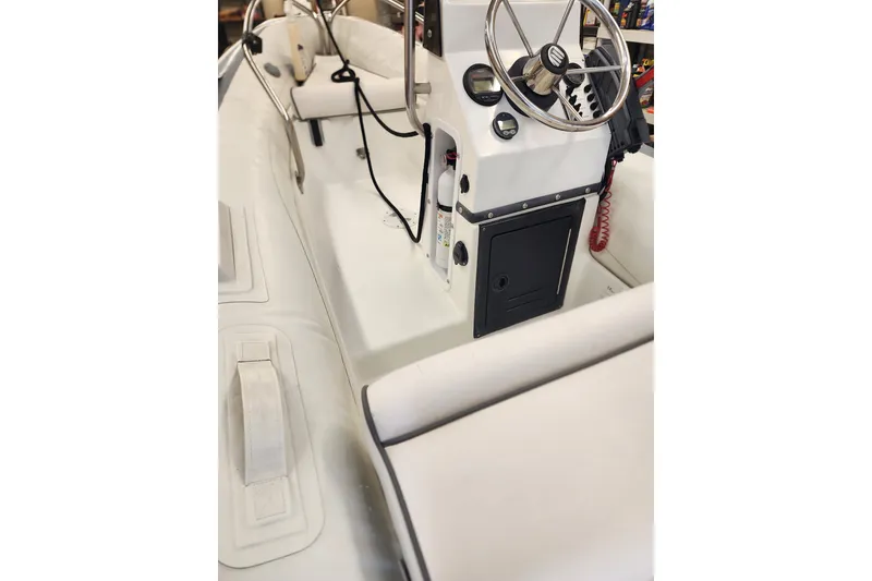 Slide: The Image of 2003 Meridian 411 Sedan boat interior with steering wheel and control panel. - 71