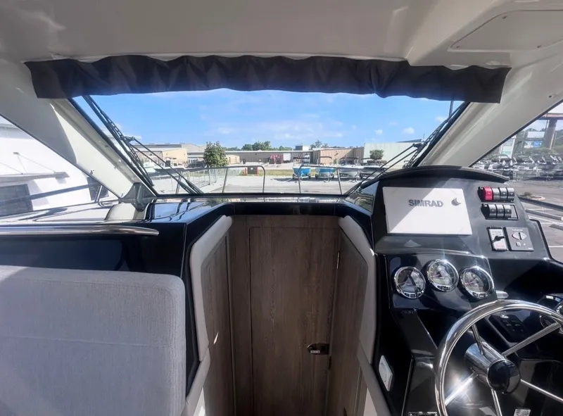 Slide: The Image of Interior view of 2026 Bayliner T29EX cockpit with modern controls. - 16