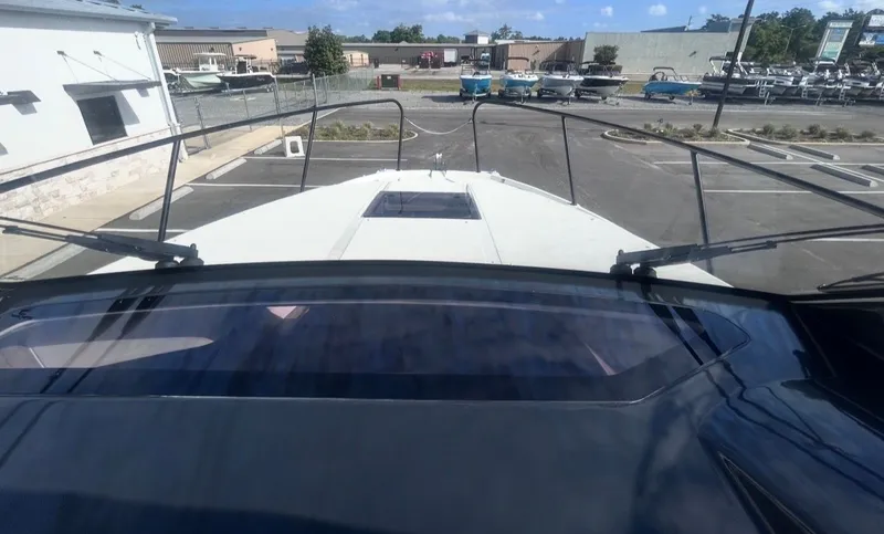 Slide: The Image of Bayliner T29EX 2026 on parking lot, front view of the boat. - 17