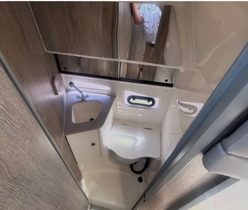 Slide: The Image of Interior view of Bayliner T29EX 2026 bathroom. - 19