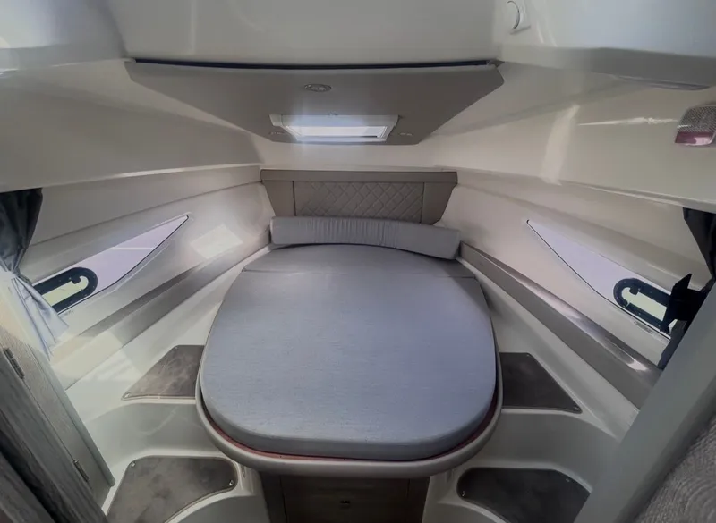 Slide: The Image of Interior of 2026 Bayliner T29EX featuring cozy sleeping area. - 21