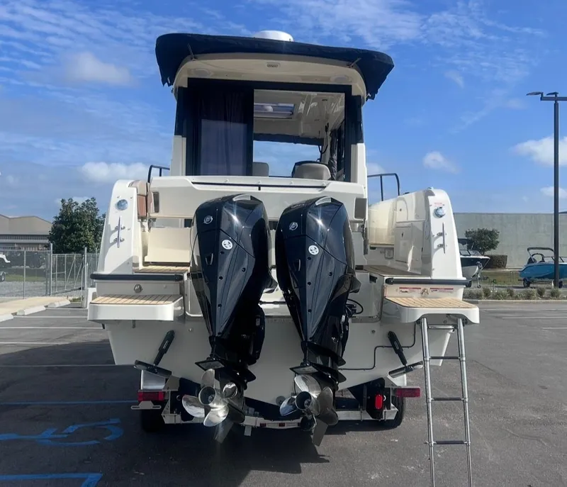 Slide: The Image of Rear view of 2026 Bayliner T29EX with dual outboard engines. - 5