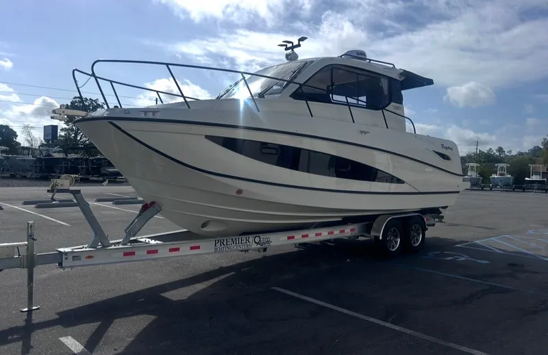 Slide: The Image of 2026 Bayliner T29EX boat parked on trailer outdoors. - 7