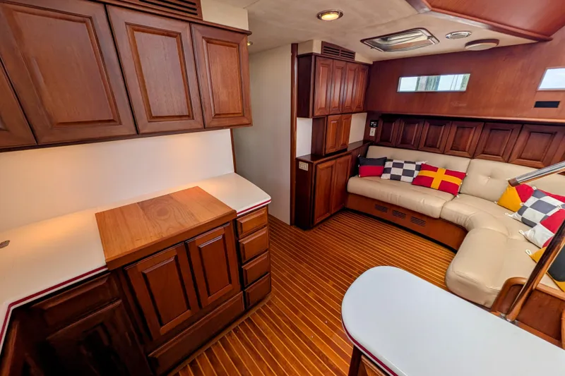 Slide: The Image of Luxurious interior of 2002 Legacy Yachts 52 Express with wood cabinetry and plush seating. - 28