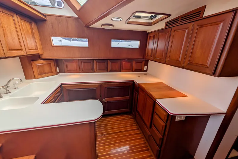 Slide: The Image of Luxurious wooden interior of 2002 Legacy Yachts 52 Express kitchen area. - 29