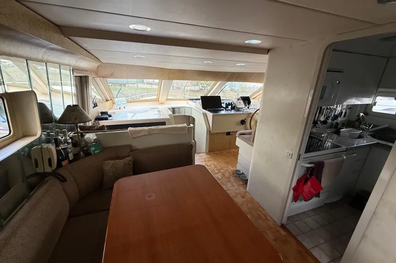 Slide: The Image of Interior of 1988 Maiora Motor Yacht with dining area and helm station. - 12