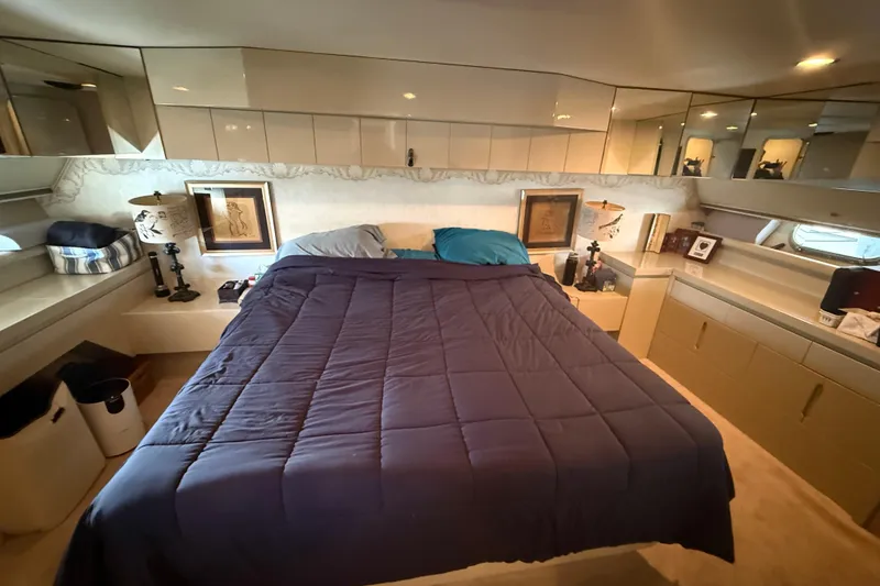 Slide: The Image of Luxurious bedroom interior of 1988 Maiora Motor Yacht with elegant decor and comfortable bedding. - 15