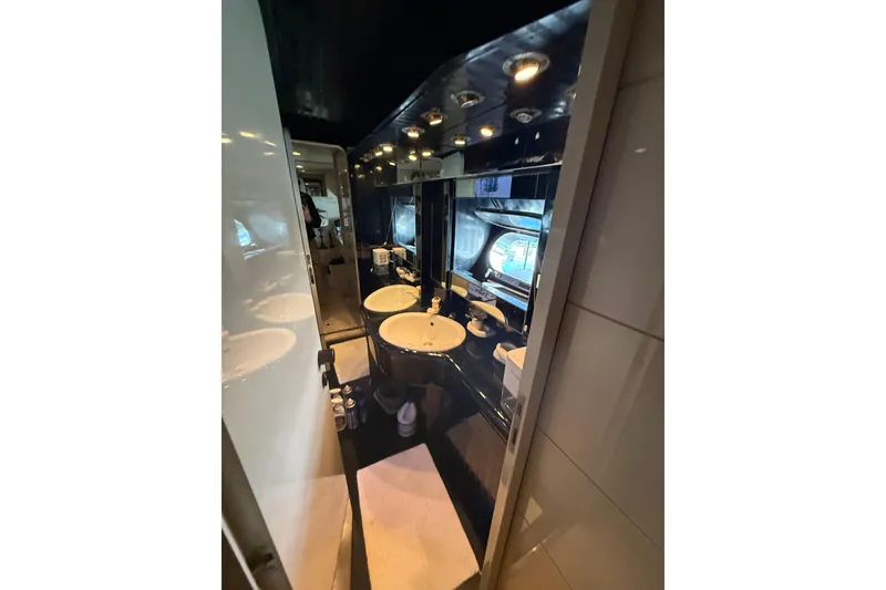 Slide: The Image of Luxurious bathroom interior of 1988 Maiora Motor Yacht with modern fixtures and lighting. - 17