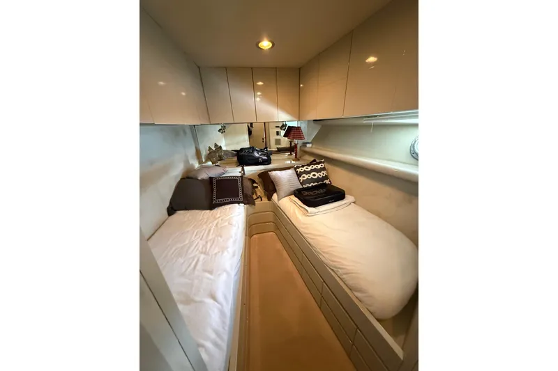 Slide: The Image of Cozy twin cabin in 1988 Maiora Motor Yacht with modern decor and soft lighting. - 18