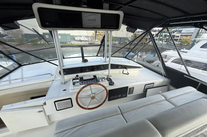 Slide: The Image of Cockpit of 1988 Maiora Motor Yacht with steering wheel and navigation equipment. - 25