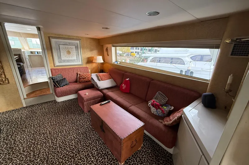 Slide: The Image of Luxurious 1988 Maiora Motor Yacht interior with plush seating and elegant decor. - 6