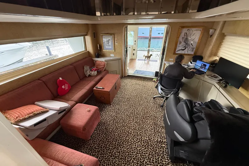 Slide: The Image of Luxurious 1988 Maiora motor yacht interior with leopard print carpet and cozy seating area. - 7