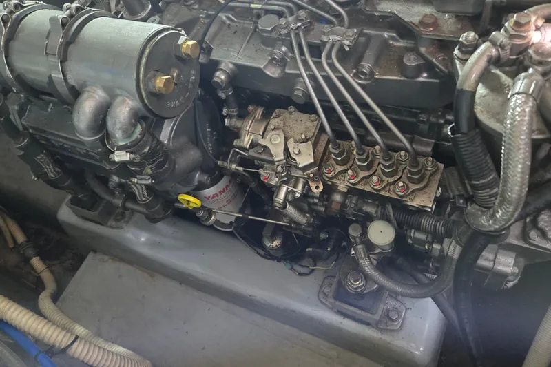 Slide: The Image of Engine of a 2003 Endeavour Trawler Cat 44, showcasing intricate mechanical components. - 100