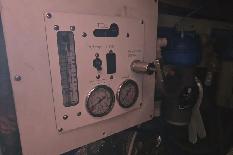 Slide: The Image of Control panel of a 2003 Endeavour Trawler Cat 44, featuring gauges and pressure indicators. - 101