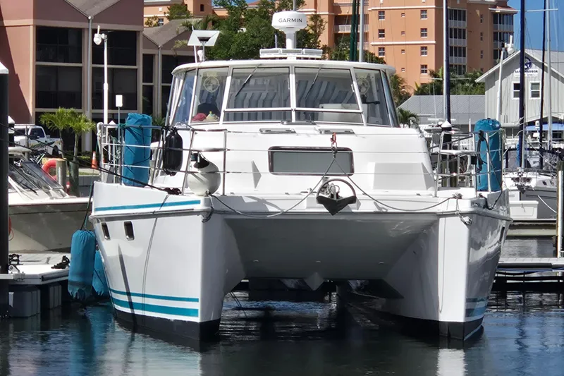 Slide: The Image of 2003 Endeavour Trawler Cat 44 docked at a marina, front view. - 113