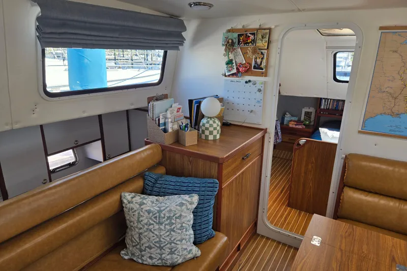 Slide: The Image of Interior of 2003 Endeavour Trawler Cat 44 with cozy seating and nautical decor. - 18