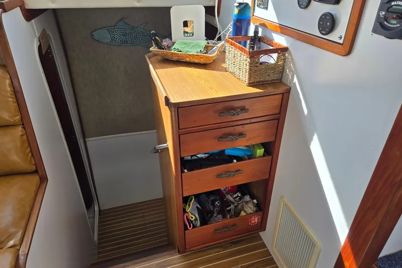 Slide: The Image of Interior of 2003 Endeavour Trawler Cat 44 with wooden drawers and nautical decor. - 20