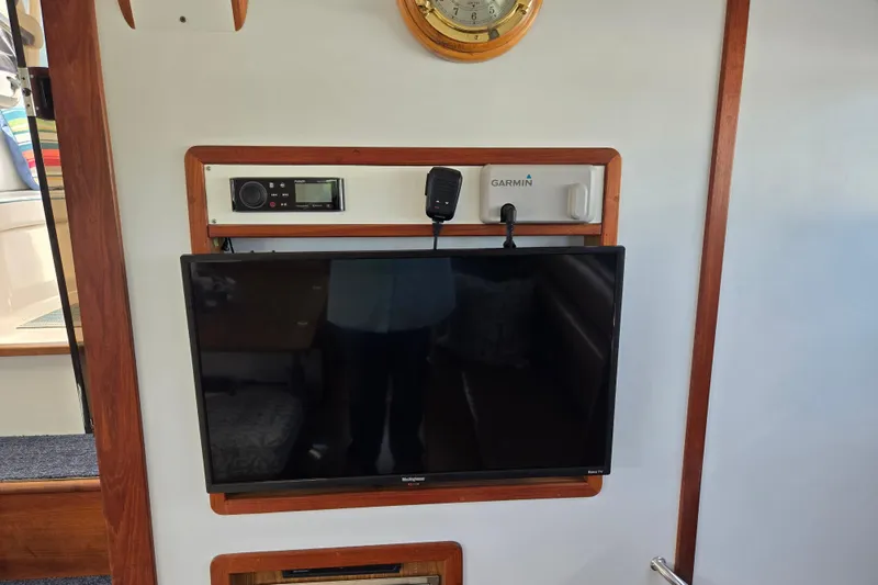 Slide: The Image of Entertainment setup on 2003 Endeavour Trawler Cat 44 with TV and Garmin equipment. - 25