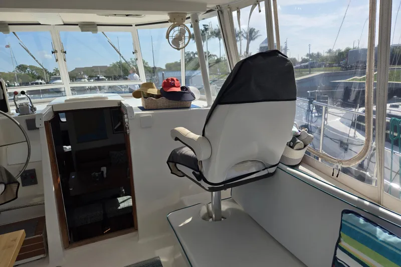 Slide: The Image of Interior view of 2003 Endeavour Trawler Cat 44, featuring helm and seating area. - 28