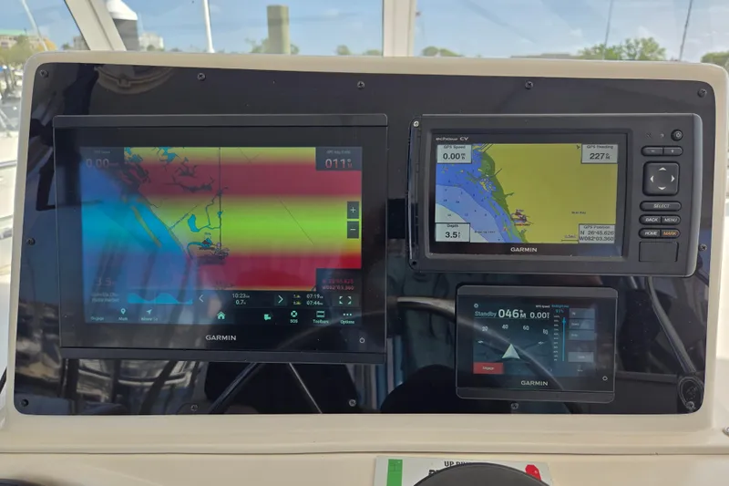 Slide: The Image of Garmin navigation displays on 2003 Endeavour Trawler Cat 44 boat dashboard. - 35