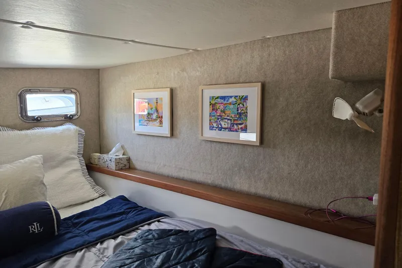 Slide: The Image of Cozy cabin interior of 2003 Endeavour Trawler Cat 44 with framed art and bedding. - 65