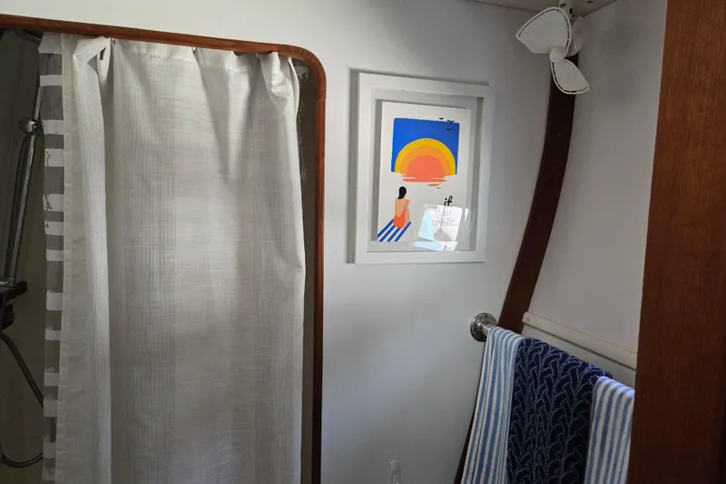 Slide: The Image of Bathroom interior of 2003 Endeavour Trawler Cat 44 with shower and framed artwork. - 70