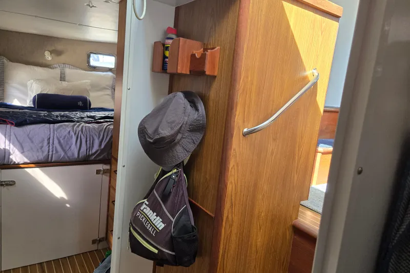 Slide: The Image of Interior of 2003 Endeavour Trawler Cat 44 with cozy bedroom and wooden cabinetry. - 72