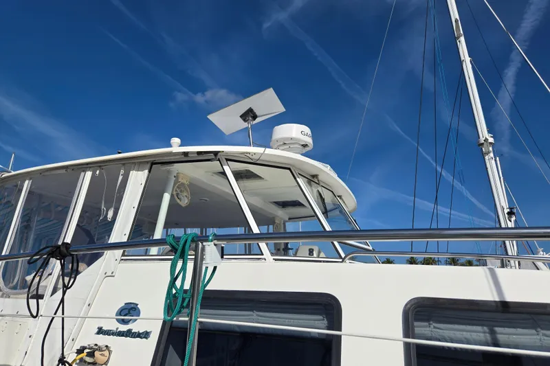 Slide: The Image of 2003 Endeavour Trawler Cat 44 boat with clear blue sky background. - 75